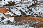 UP 8664, 9021, 7781 (SD70ACE, SD70ACE, C45ACCTE) lead an eastbound stack train, exiting a small tunnel at Castle Rock, Utah. February 19, 2022 {Winter Echofest}